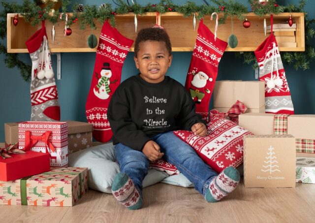 Toddler "Believe in the Miracle" Black Long Sleeved Heavy Blend Christmas Sweatshirt