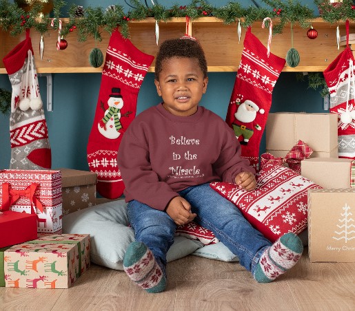 Toddler "Believe in the Miracle" Cranberry Long Sleeved Heavy Blend Christmas Sweatshirt